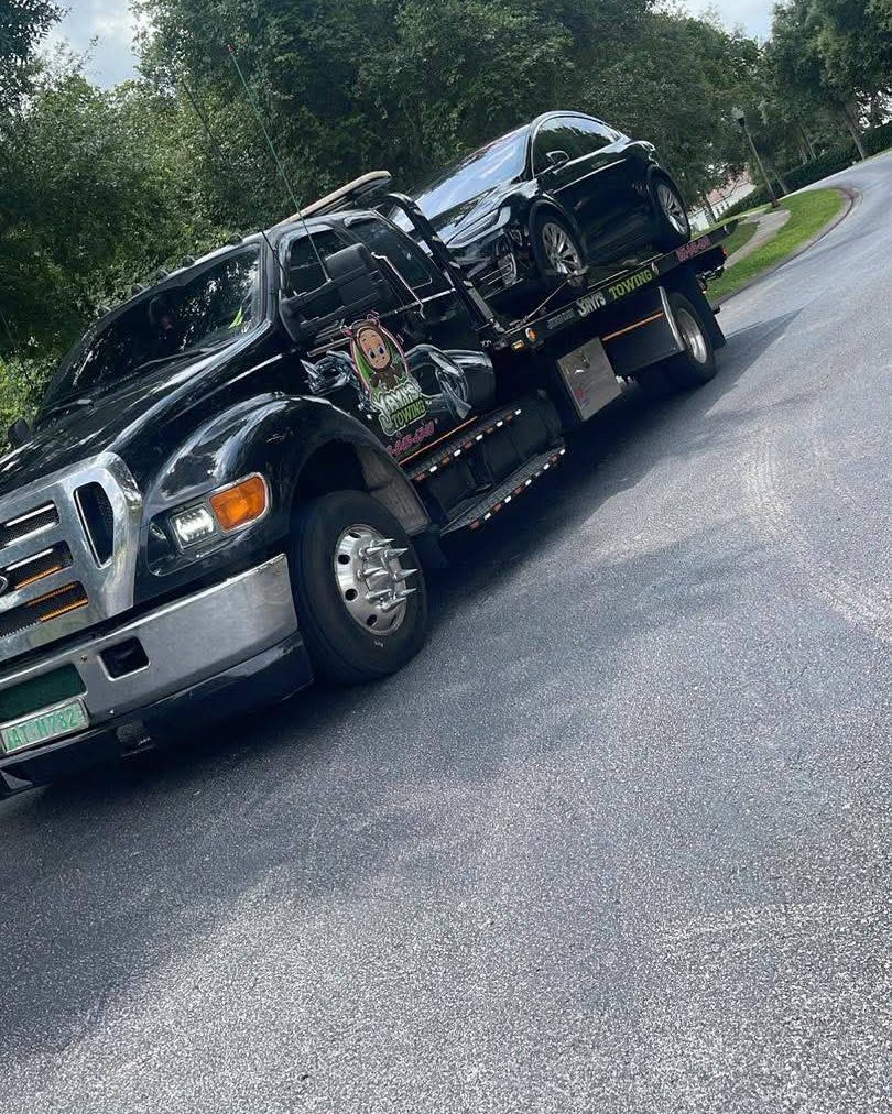 Tesla secured on a Yayi’s Towing flatbed in Polk County, FL